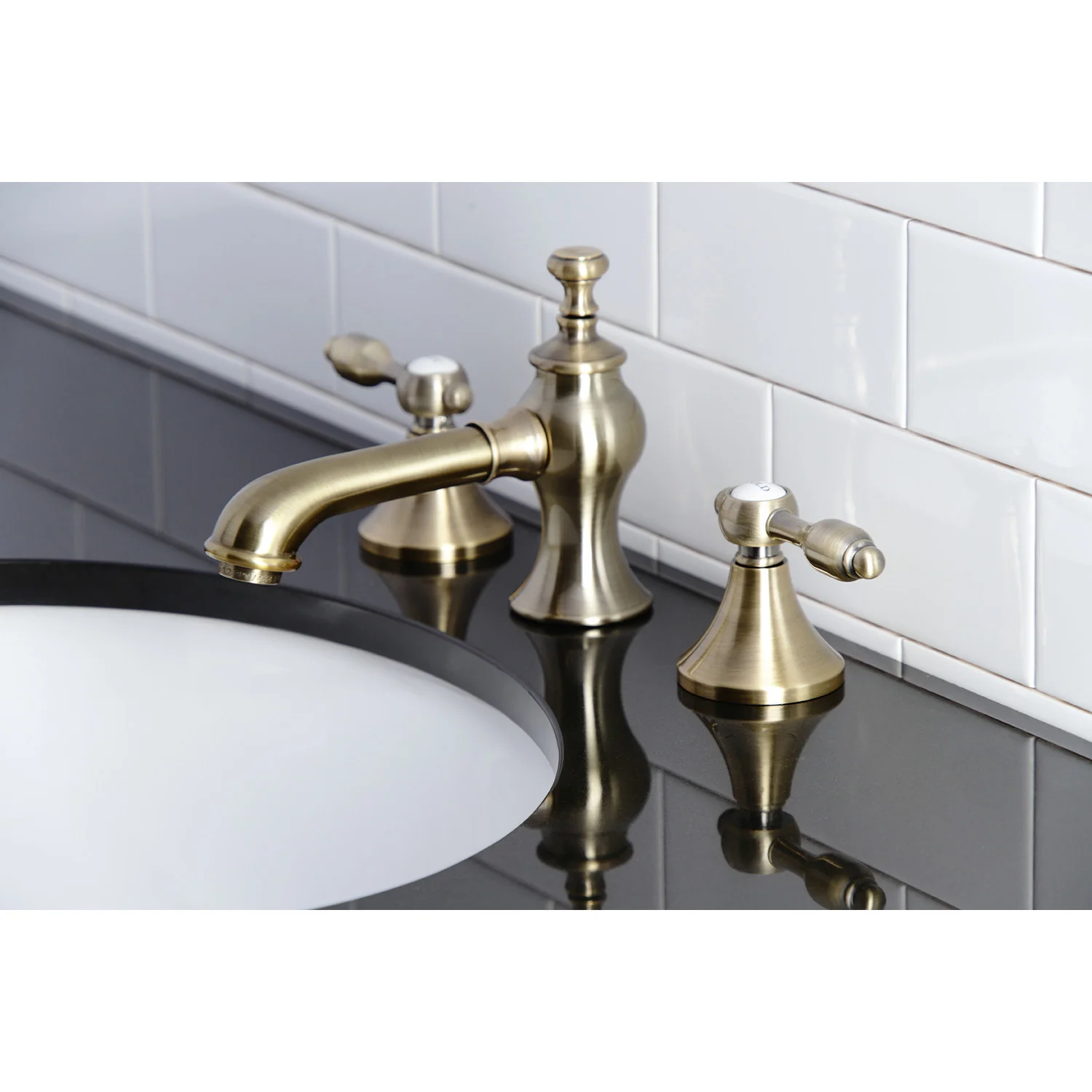 Kingston Tulare KC7063TAL - Tudor Two-Handle 3-Hole Deck Mount Widespread Bathroom Faucet with Brass Pop-Up, Antique Brass - Image 2